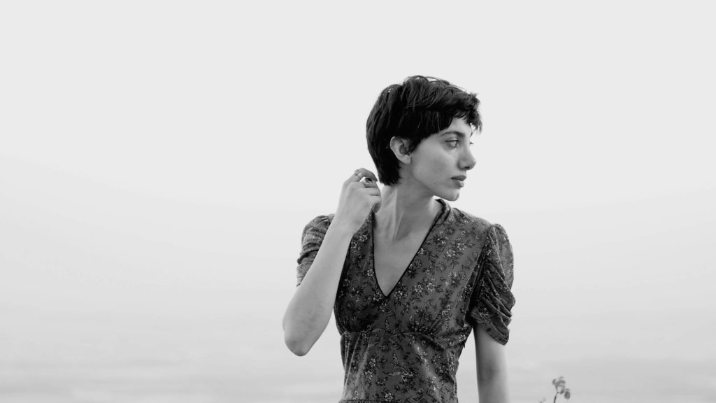 a woman with her hands in her hair